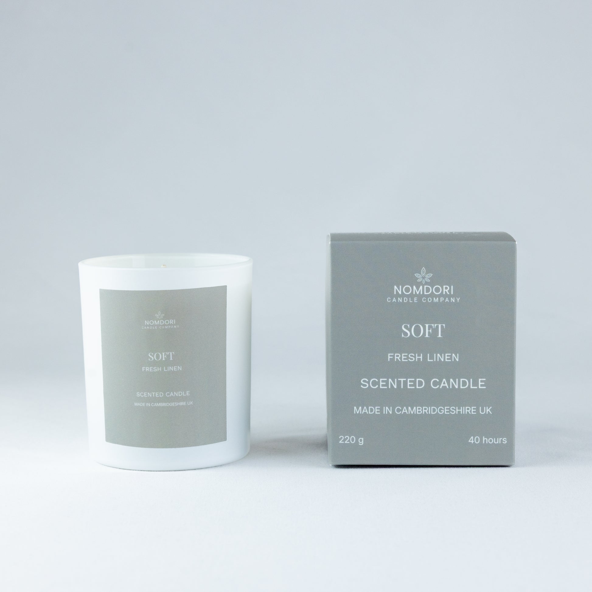 Nomdori Soft Candle 220g in Fresh Linen scent, a hand-poured candle in a clean white matt vessel