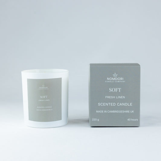 Nomdori Soft Candle 220g in Fresh Linen scent, a hand-poured candle in a clean white matt vessel